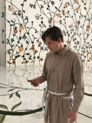 Me (always working on my phone) at the Sheikh Zayed Grand Mosque